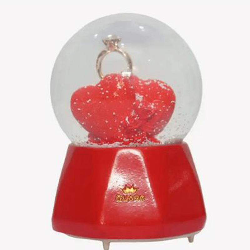 Γυάλινη Xιονόμπαλα με Καρδιές Δαχτυλίδι & Μουσική 9x6cm Γυάλινη Xιονόμπαλα με Καρδιές Δαχτυλίδι & Μουσική 9x6cm